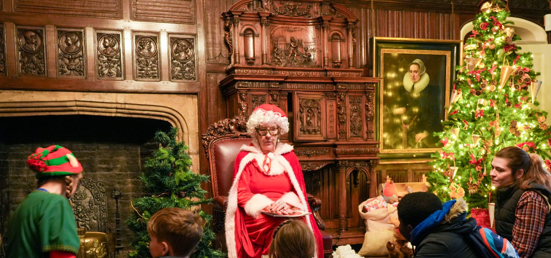 A group of people listening to festive storytime with Mrs Claus